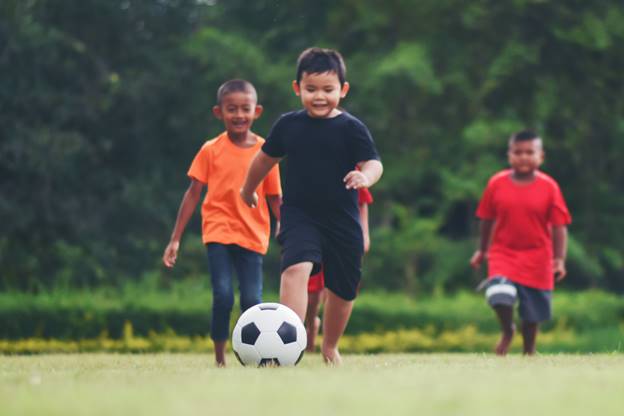 child suffered from cancer playing football