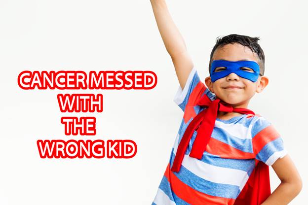 child with cancer wearing super hero outfits